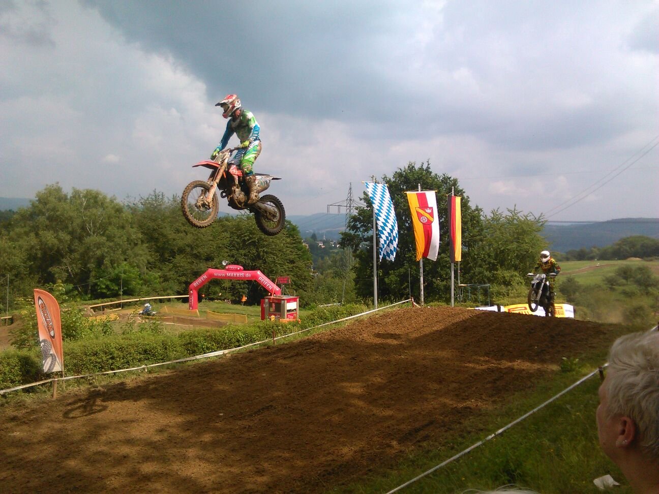 Motocross riders jumping in Goldbach, Lower Franconia, Germany | Goldbach in Germany