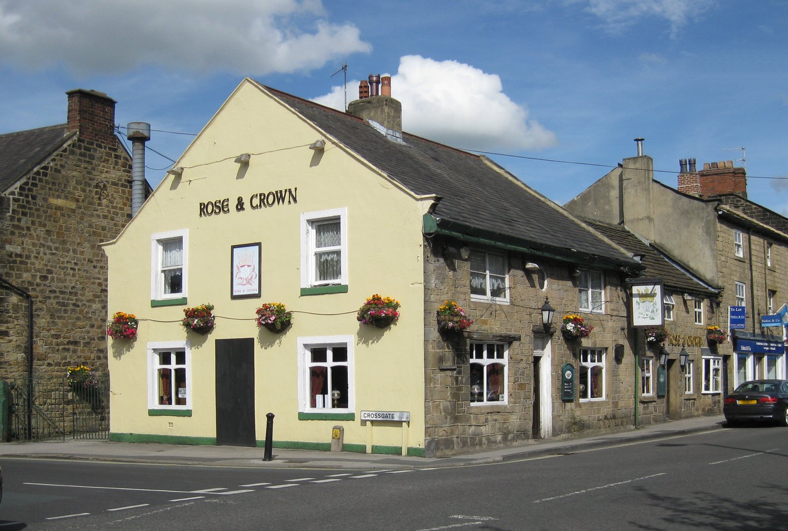 Rose &amp; Crown pub, 20 Bondgate, Otley LS21 1AD.  On the corner with Crossgate.  Stone built with slate roof. Grade II listed.  17th century remodelled in 1731.  Modern windows. | Otley in United Kingdom