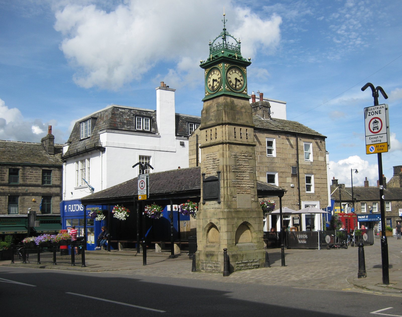 Otley Jubilee Tower and marketplace viewed from Kirkgate.  The covered structure behind the tower is the Buttercross, dating from the 1800s | Otley in United Kingdom