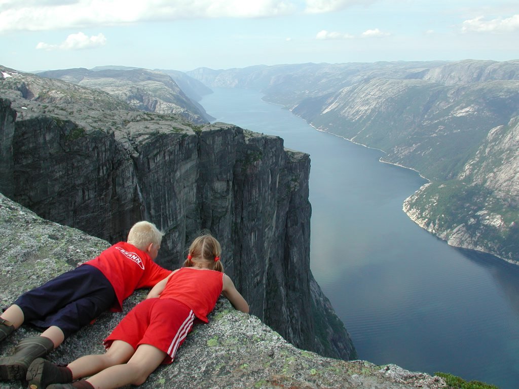Kjerag in Lysefjorden, Rogaland - Norway. The drop is 1084 m. Kjerag has become a popular BASE jumping destination. In Wikipedia you can find a list of jumpers who perished at Kjerag: The list contains 9 names (07). | Lysen in Norway
