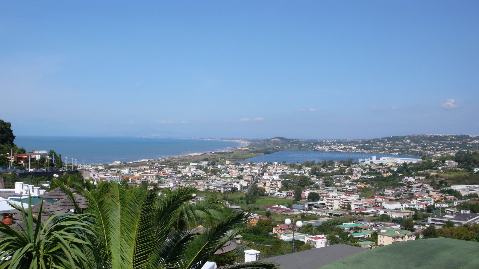 Comune di Bacoli: frazione di Cappella e di Fusaro, con il Lago Fusaro e in fondo la piccola collina dell'acropoli di Cuma. | Bacoli in Italy