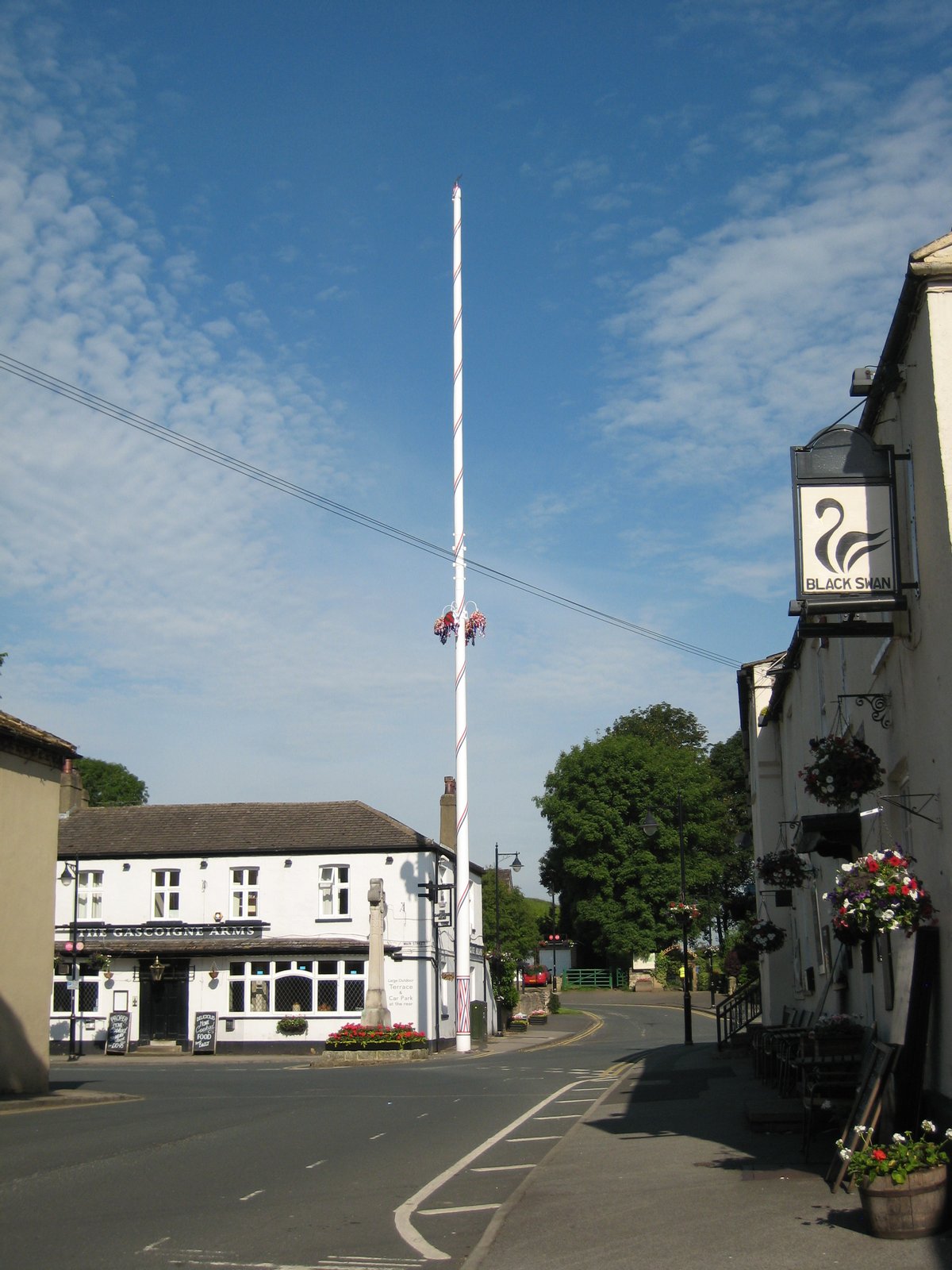 Barwick-in-Elmet showing The Gascoigne Arms, the village cross, the maypole and the Black Swan | Barwick in Elmet in United Kingdom