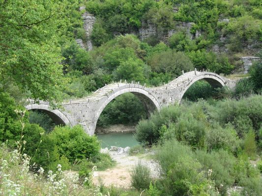 Bridge near the village of Kipoi, known as Plakida's or Kalokeriko (monk's) bridge; famous stone arch bridge in Vikos-Aoos National Park, Ioannina Prefecture, NW Greece | Kipoi in Greece