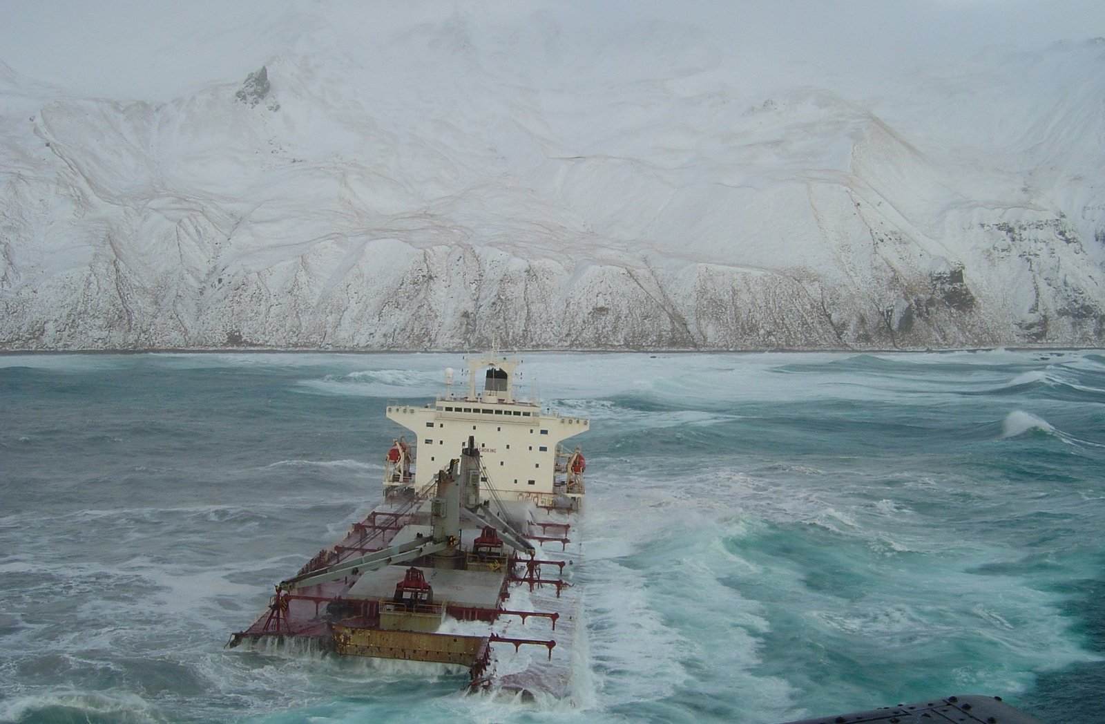 Bulk carrier Selendang aground on Unalaska Island. Although carrying a cargo of soybeans, the ship spilled approximately 350,000 gallons of fuel oil and diesel oil. Alaska, Aleutian Islands, Unalaska Island. | Unalaska Island in United States