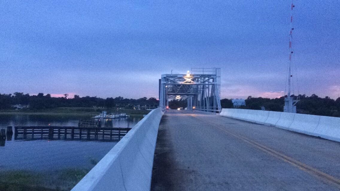 Guarded, private bridge to the island | Figure Eight Island in United States