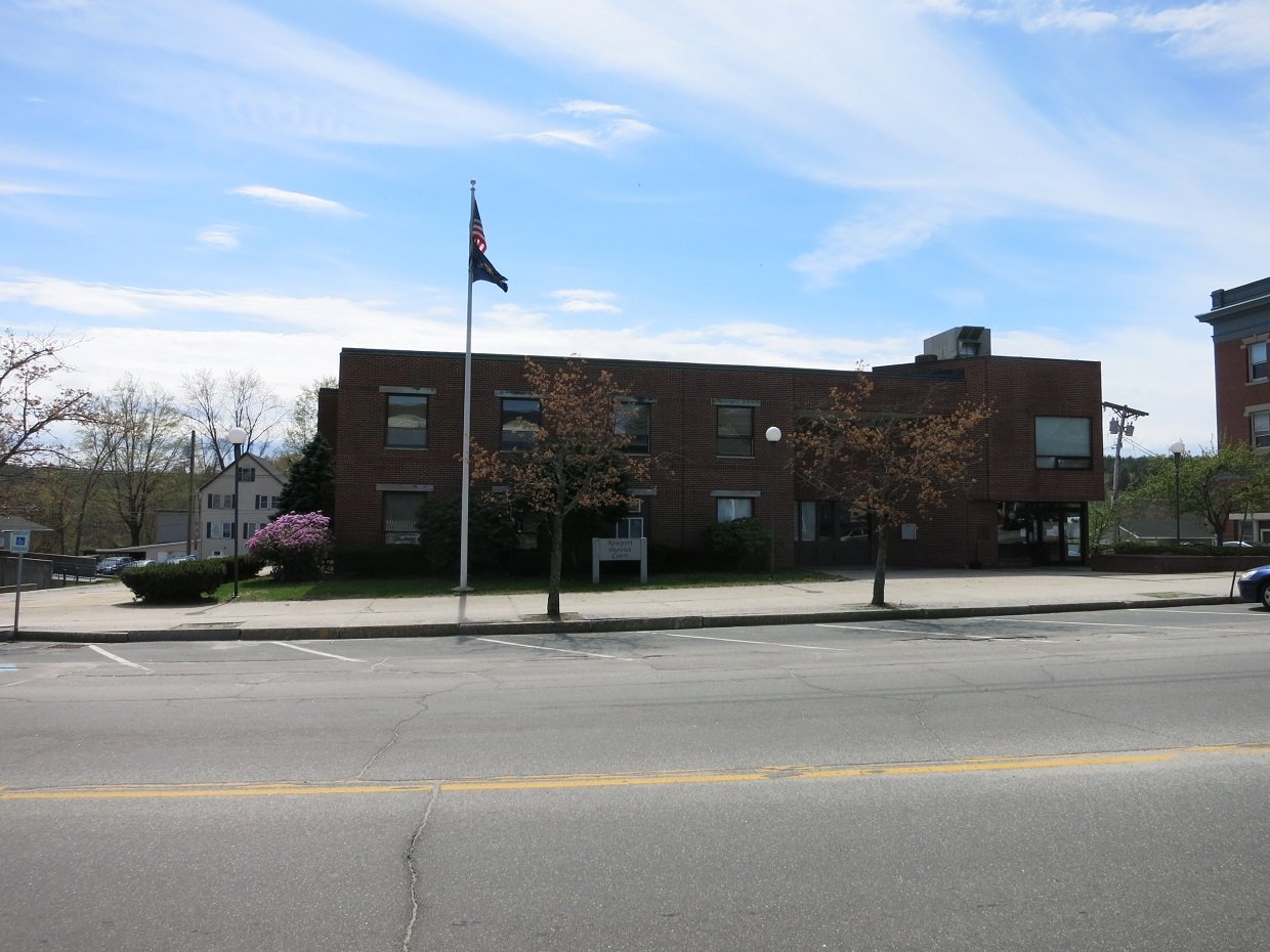 Photo shows the District Court building at 55 Main St, Newport, NH 03773. View is toward the southeast from across the street. | Newport in United States
