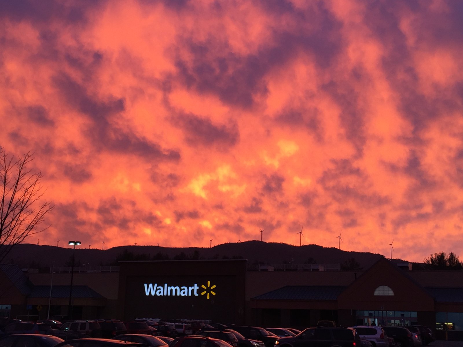 A stunning sunset over the Walmart Supercenter in Plymouth, NH. Windmills in Groton, NH are visible on the ridge in the background. | Plymouth in United States