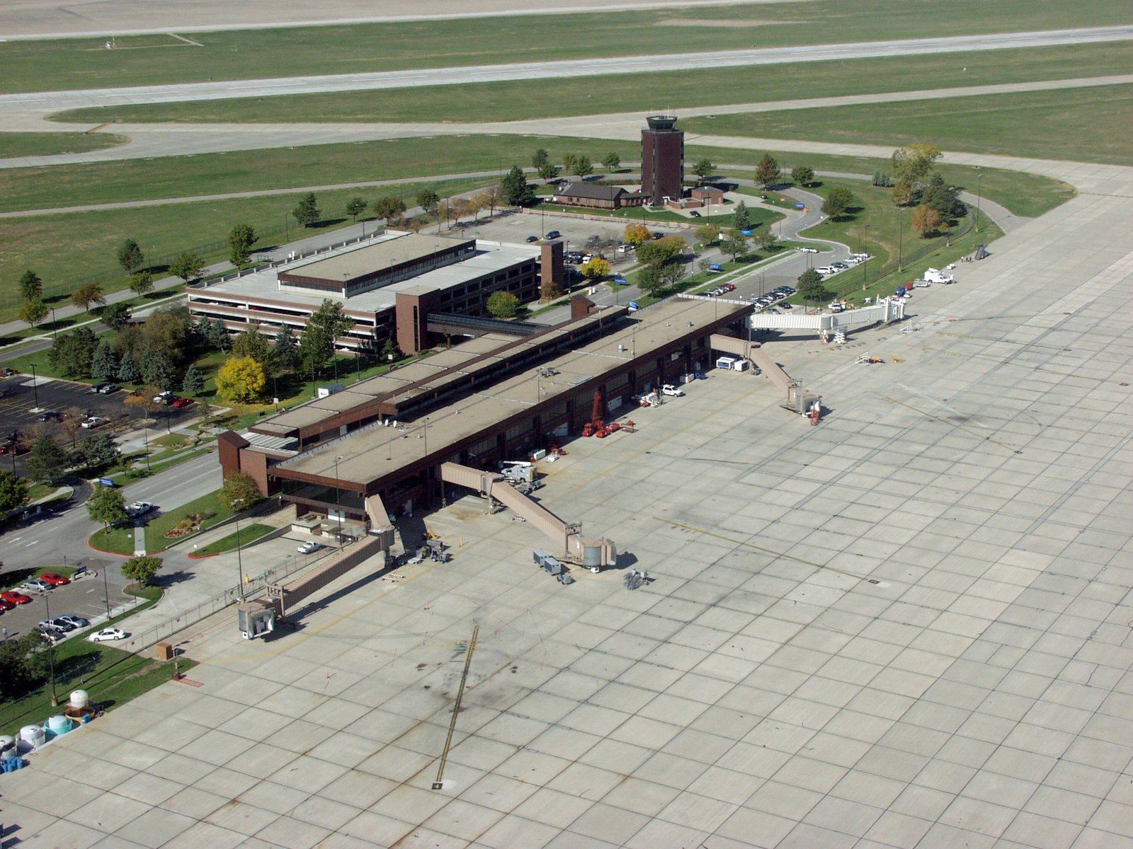 The Lincoln, Neb., airport, showing all four gates, the terminal, parking garage and control tower. | Lincoln in United States