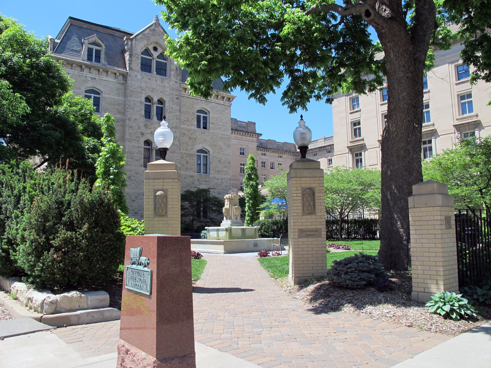 Photo is of Government square, Lincoln, Nebraska.  Photo is taken at the northwest corner of 10th &amp; "O" Streets, looking northwest into the square. The square is situated next to old city hall (left of center, in background of photo), which is just south of the old federal courthouse (from right to center, in background of photo).  The square has a fountain and is a flower garden. | Lincoln in United States
