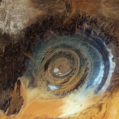Landsat 8 Collection 2 image of the Richat Structure Detailed Description This Landsat 8 Collection 2 image was acquired over the Richat Structure near the western edge of the Sahara Desert on April 25, 2020 and is shown as a natural color composite using the red, green, and blue bands (Bands 4,3,2). Also known as the Eye of the Sahara or Guelb er Richat, the Eye is a symmetrical dome of eroded sedimentary and volcanic rock. The outermost rings measure approximately 40 km (25 miles) across. | Richat Structure in Mauritania